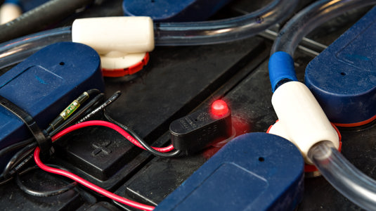 blinky electrolyte indicator attached to industrial battery